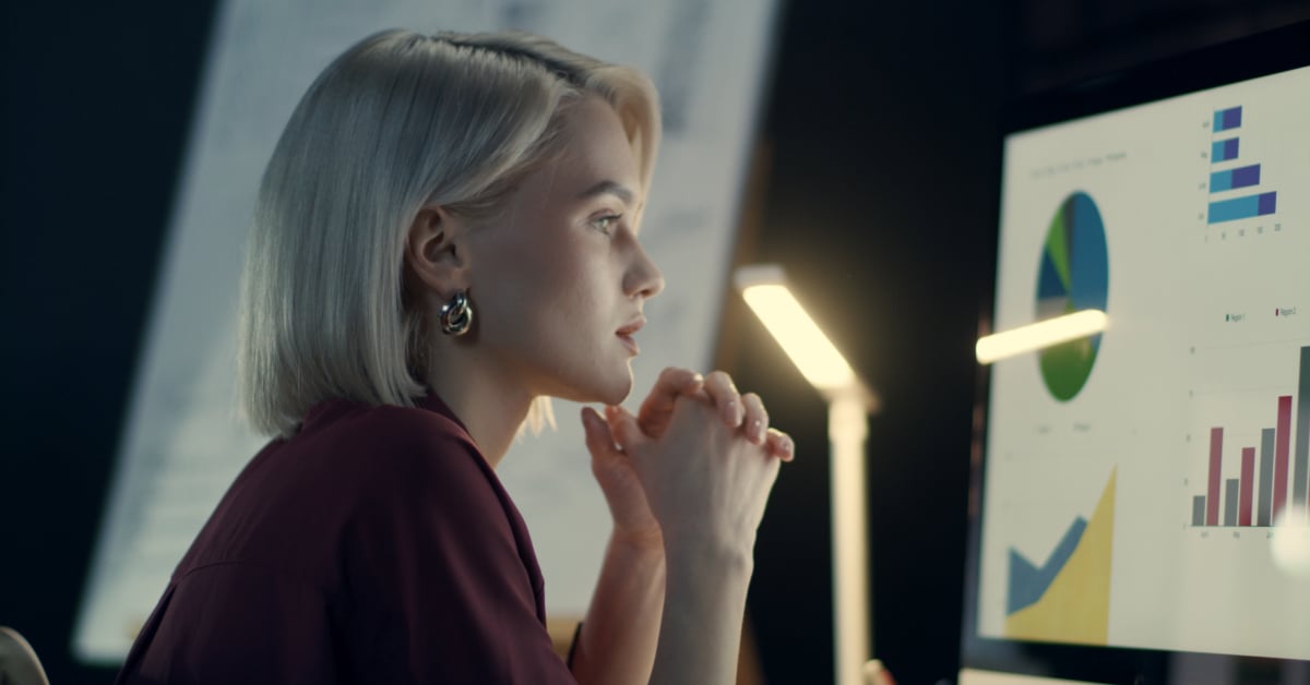 Manager reviewing charts to gain real-time insights into sales commissions